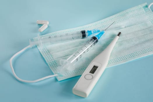Fighting the virus and the epidemic with vaccines, pills and a medical mask