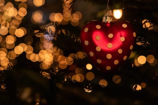 Christmas tree decoration, heart with bokeh in the background
