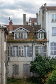 a facade of old building, french town