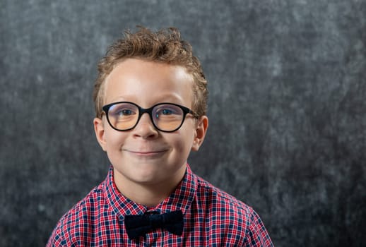 a portrait of a funny boy with glasses