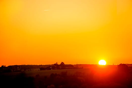 sunset with afterglow and power mast