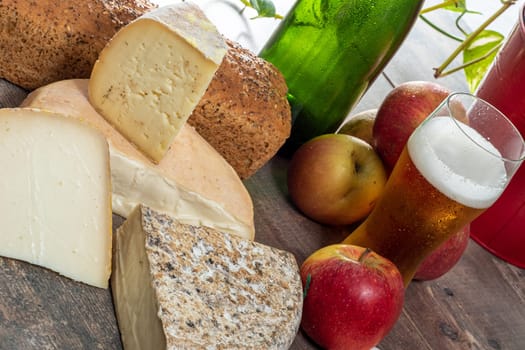 cheeses and Tomme de Savoie with beer, French cheese Savoy, the french Alps France.