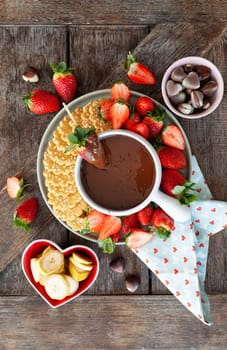 Chocolate fondue with fresh strawberries and cookies