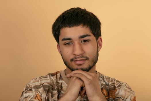 Friendly young Man on beige Background
