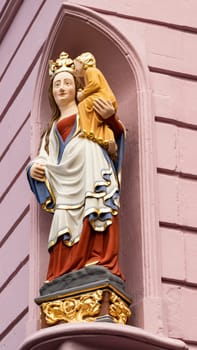 Colorful Madonna with Child in Trier, Germany on a house Facade