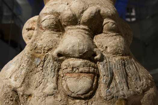 Barcelona, Spain - Dec 27th, 2019: Ancient Egypt God Bes. Face closeup. Museum of Ancient Egypt Culture of Barcelona, Spain