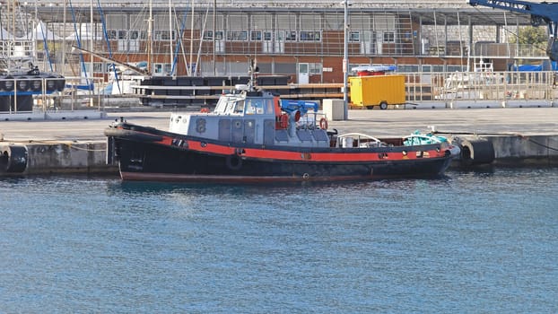 Tug boat moored at port in Nice