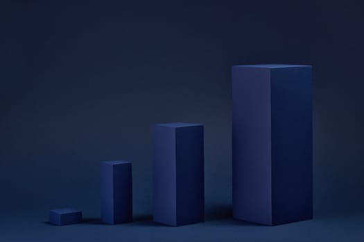 Abstract composition with geometric figures. Set of rectangular parallelepipedes on a blue background. Abstract background with copy space for design of advertising, engineering draft, web design.