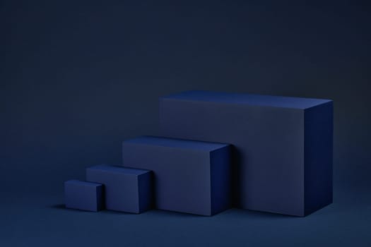 Abstract composition with geometric figures. Set of rectangular parallelepipedes on a blue background. Abstract background with copy space for design of advertising, engineering draft, web design.