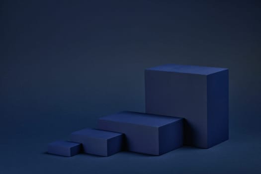 Abstract composition with geometric figures. Set of rectangular parallelepipedes on a blue background. Abstract background with copy space for design of advertising, engineering draft, web design.