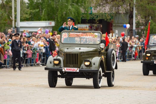Anapa, Russia - May 9, 2019: Veterans ride on Anapa Theater Square to celebrate Victory Day
