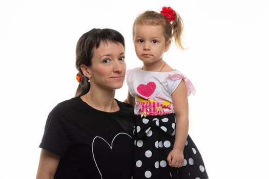 Portrait of a mother with a four-year-old daughter on a white background