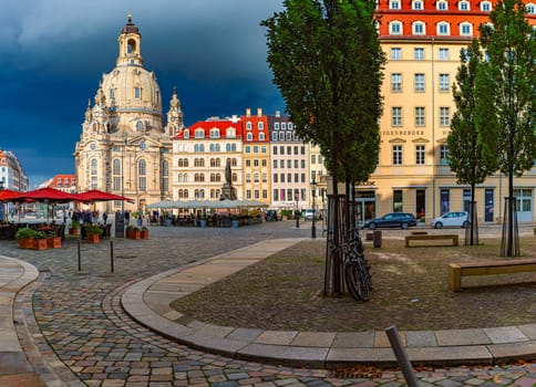 DRESDEN, GERMANY - SEPTEMBER 22, 2014: Frauenkirche cathedral in Dresden, Germany. Church of Our Lady is a Lutheran church in state of Saxony. View from square with people walking around