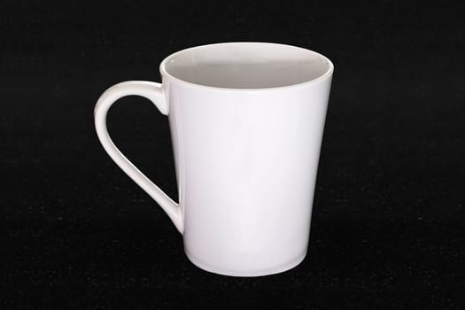 white mug black background closeup object single