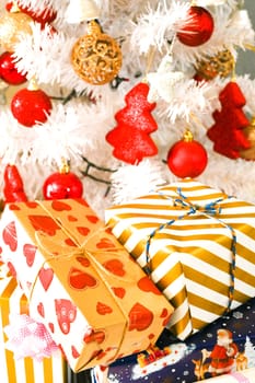 White Christmas tree, with red decoration and christmas light