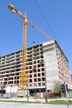 Apartment building constructions, with big crane in motion
