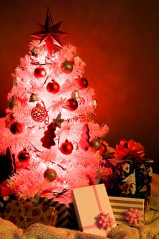 White Christmas tree, with red decoration and christmas light