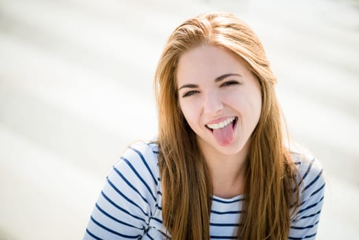 Teenager portrait - smiling girl outdoor on sunny day