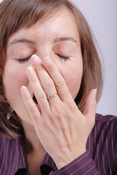 Young business woman yawning - detail