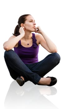 Portrait of young woman sitting on ground looking away - isolated on white background
