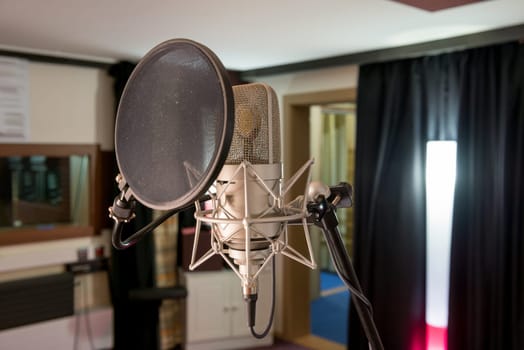 professional microphone in a recording studio
