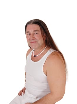 A happy indigenous man posing for a portrait image with.his long brunette hair, isolated for white background.