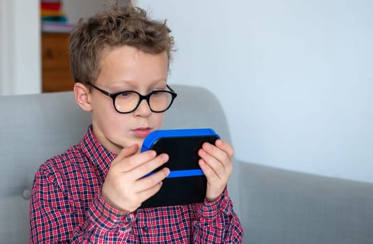 child boy playing with video game