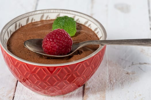 Homemade chocolate mousse with the  fresh raspberry