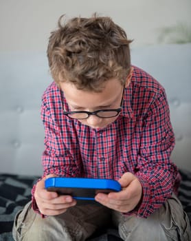 child boy playing with video game