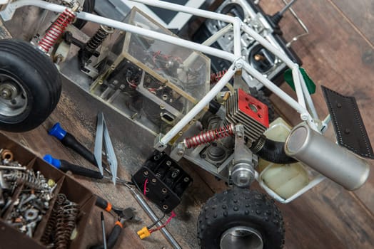 Radio-controlled car model with the tools for repairing rc buggy models