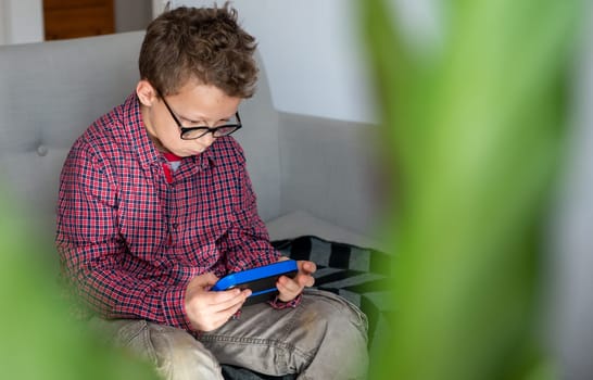 child boy playing with video game
