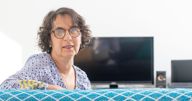 a portrait of a beautiful brunette senior woman