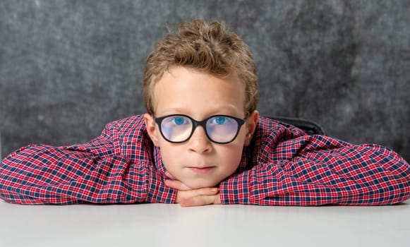 a portrait of a cute child with checkered shirt