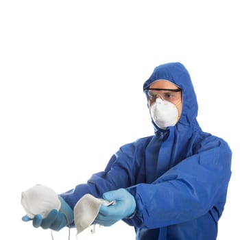 Man in protective clothing give face masks to someone. Coronavirus concept.