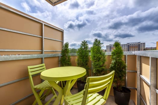 sitting on the balcony of the apartment - High quality photo