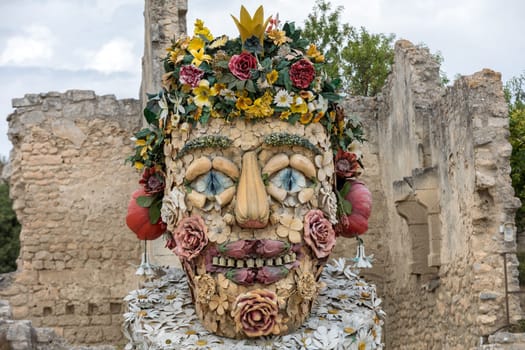 Les Baux, France - June 26, 2017: The artwork, titled Spring is Four Seasons three-dimensional interpretations created by Philip Haas and inspired by a set of paintings with the same titles by Italian Renaissance artist Giuseppe Arcimbaldo. Each season is represented by the bust of an oversized figure composed of fruits, flowers, and other vegetation symbolic of that time of year.