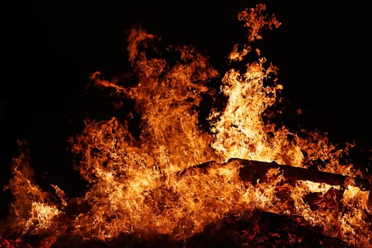 A big glowing fire with high flames