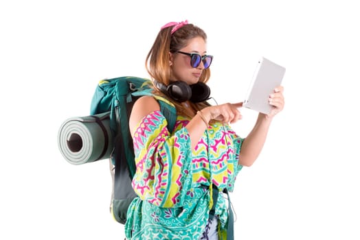 Hiker girl with tablet isolated in white, trekking and travel lifestyle concept