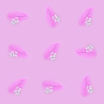 Seamless texture of pink feather and eggs on a pink background. Easter concept