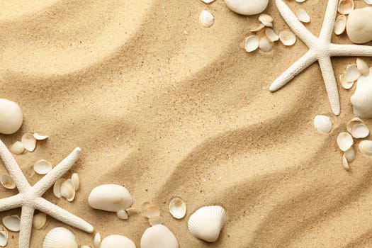 Starfishes, stones and seashells on sand background. Flat lay. Top view