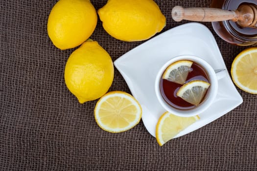 Cup of tea with honey and lemon. Spicy medicinal tea for autumn-winter season.