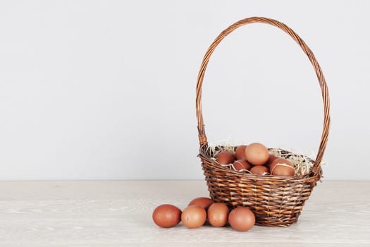 A basket of fresh eggs on kitchen counter with copy space