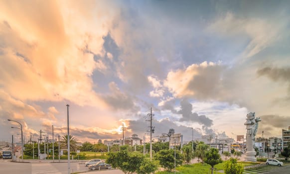 Sunrise on the  giant stone dragon head of the pillars that greet cruise ship visitors close to the Naha Port Cruise Terminal dock, symbol of sister cities Naha and Fuzhou in China.