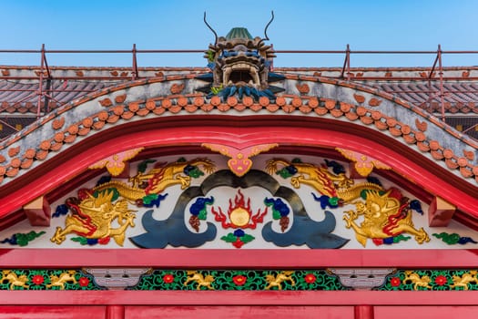 Shuri Castle's karahafu style red tiled roof decorated with dragons in the Shuri neighborhood of Naha, the capital of Okinawa Prefecture, Japan.