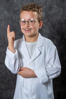 Happy retro boy pointing his finger up
