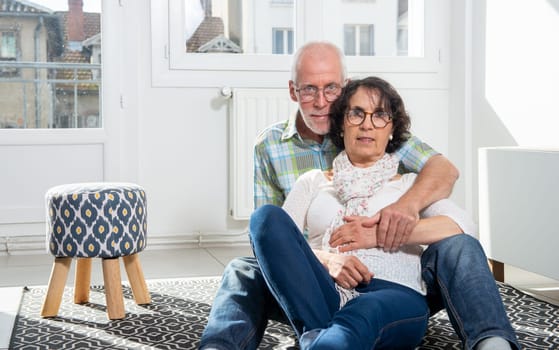 happy senior couple in a living room