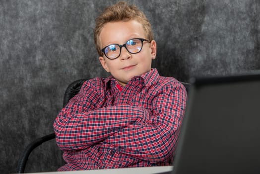 portrait of a cute child with a checkered shirt