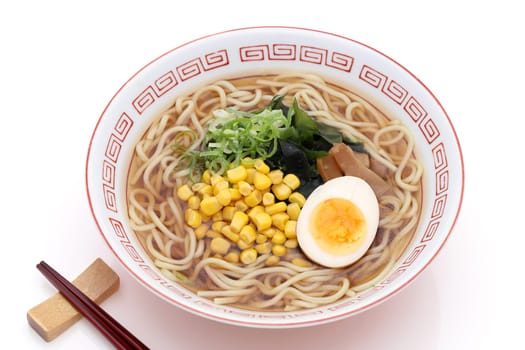 Japanese Soy sauce noodles with chopsticks. Isolated on white