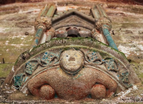 Plouha, France, August 15, 2019: Chapel of Kermaria an Iskuit - sculpture above the entrance to the Chapel of Kermaria an Iskuit from 13th century