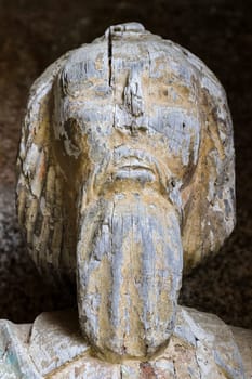 Plouha, France, August 15, 2019: Chapel of Kermaria an Iskuit - medieval wooden statues of saint - apostle - at the entrance to the chapel of Kermaria an Iskuit from 13th century